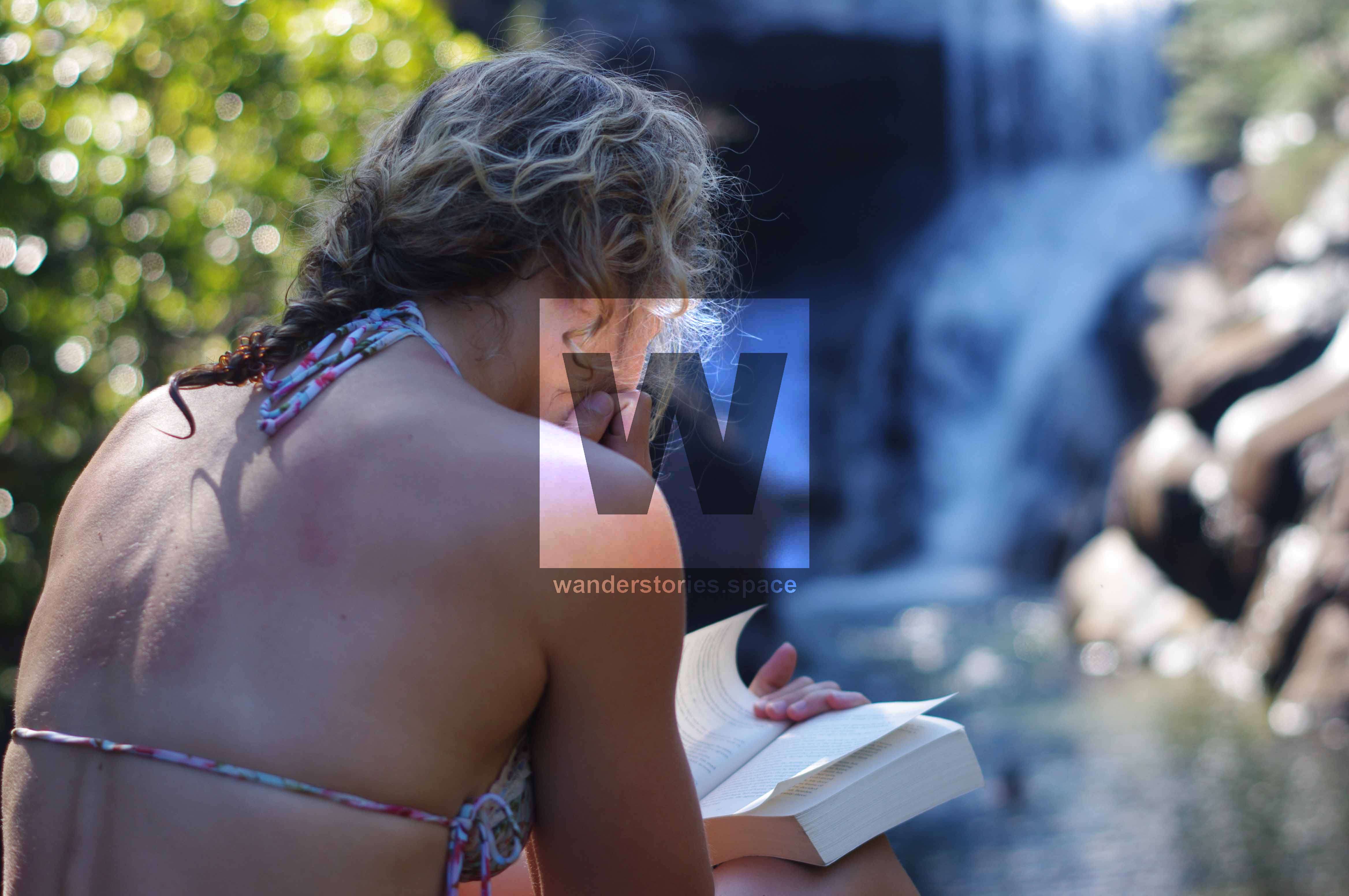 Reading a book at Mulligan waterfall