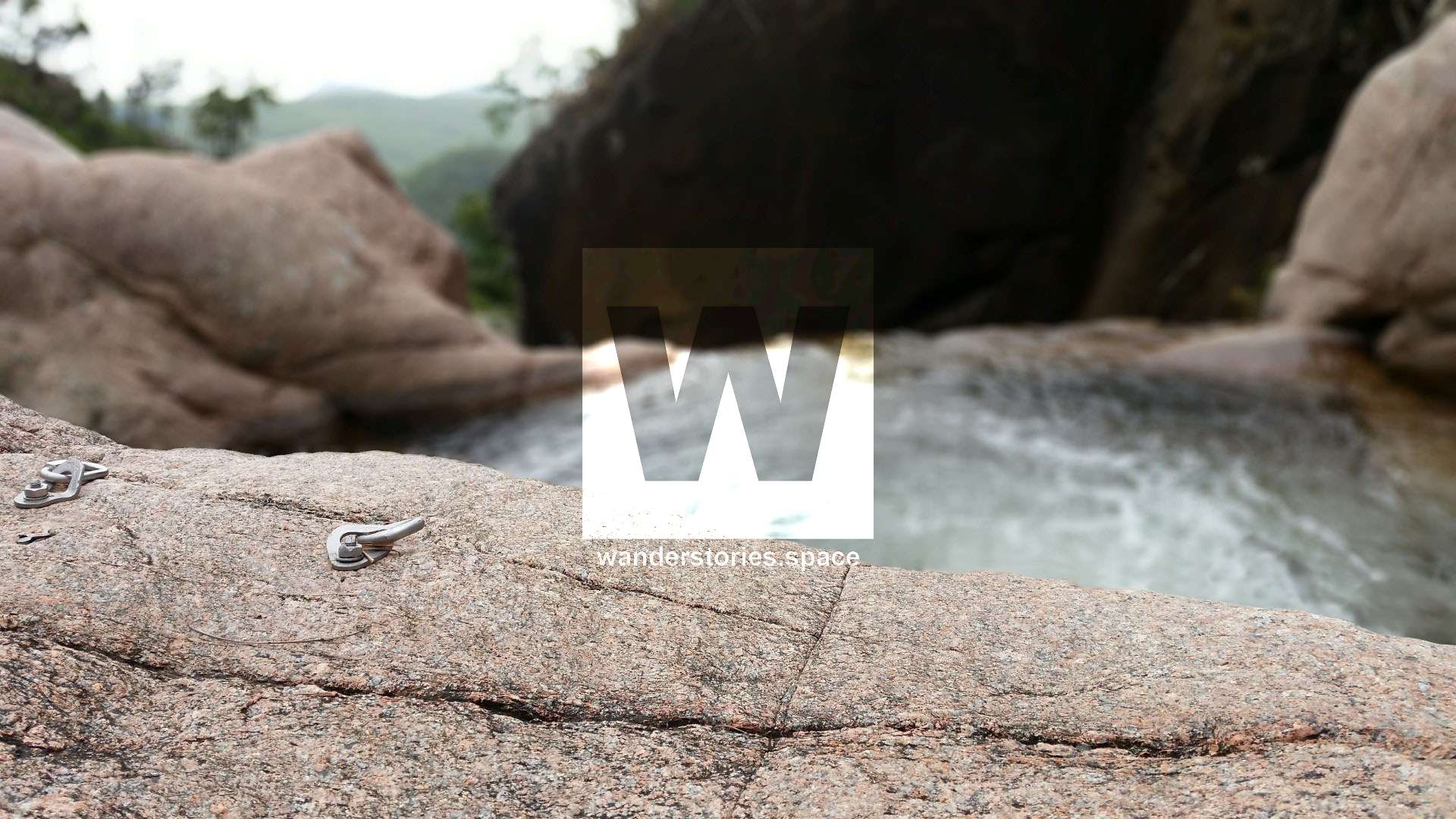 Rock climbing anchors at top of Jourama Falls